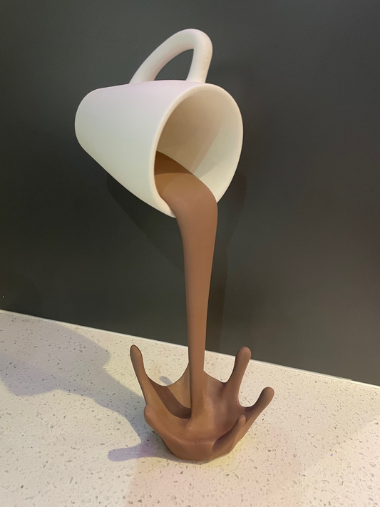 Floating coffee cup sculpture